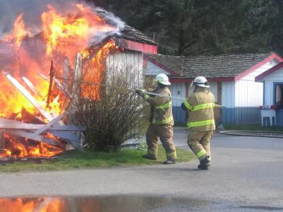 fire fighters using tools to fight fire