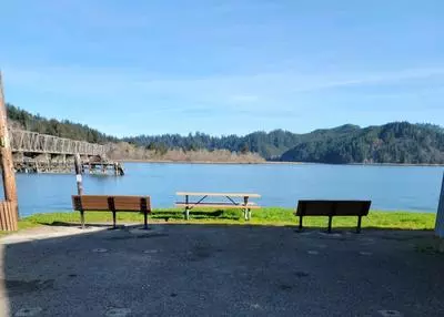 new benches and picnic table overlooking the river